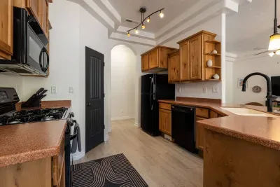 Fully stocked kitchen with full-sized appliances.