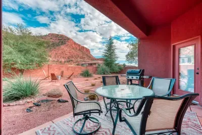 Gas grill and patio furniture for outdoor meals. 