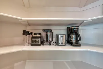 Large pantry with small appliances available for your stay. 