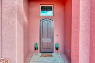 Welcoming front door with smart lock for easy entry. 