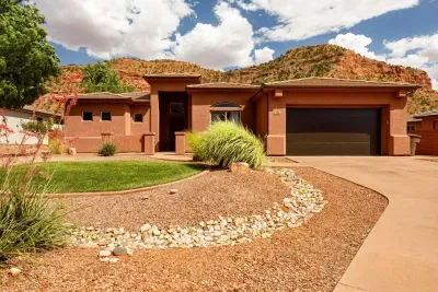 Gorgeous home with two-car garage. Surrounded by red cliffs and desert views.