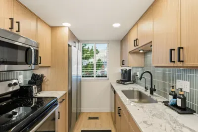 Newly remodeled kitchen with full-sized appliances and everything you need to cook a meal.