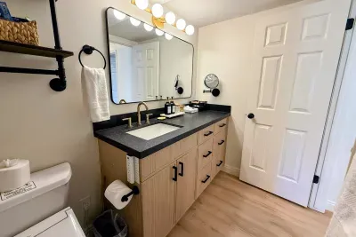 Full bathroom with heated bidet and tub/shower combo.