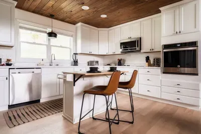 Spacious and fully stocked kitchen with the latest appliances, pots, pans, blender, spatulas, cups, plates, bowls, spoons, forks, knives and basic spices to whip up delicious meals.