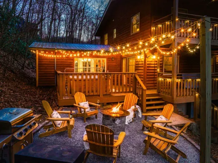 Stunning fire pit area (adorned with string lights) to relax and make smores with the family.