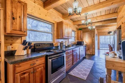 Spacious and fully stocked kitchen with the latest appliances, pots, pans, blender, spatulas, cups, plates, bowls, spoons, forks, knives and basic spices to whip up delicious meals.