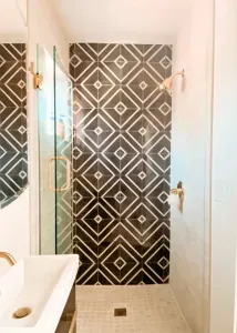 Tastefully designed bathroom with glazed porcelain accent tiles crafted in Spain.