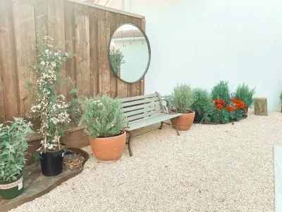 Beautiful outdoor graveled garden to relax or for kids or pets