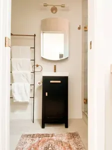 Comfortable bathroom with plenty of under cabinet and medicine cabinet storage.