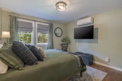 Relax and unwind in the comfortable queen bedroom.  Equipped with blackout curtains, turn on the A/C or open your windows to listen to the sound of nature.