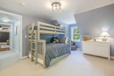 Bunk room with twin, full and full trundle.  This room can fit up to five guests.