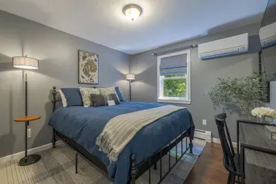 First floor bedroom with queen bed, full closet and smart tv.