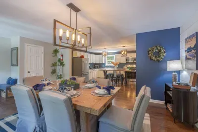 Enjoy a home cooked meal with the family in our comfortable dining room.  Neet more room?  Then kitchen island can be used to serve four additional guests.