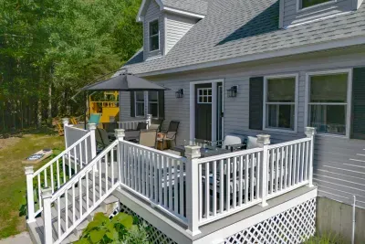 Deck with dining table, leisure chairs and gas fireplace