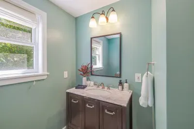 First floor bathroom with luxury linens and new walk in shower