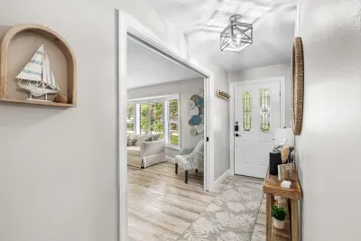 A warm and welcoming entrance that immediately sets the tone for a relaxing coastal escape. Bright, airy, and thoughtfully styled with charming seaside details, it offers guests a beautiful first glimpse of the comfort and care waiting inside.