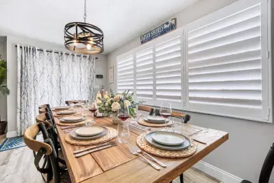 The formal dining area provides an elegant setting for group dinners, celebrations, and memorable meals together, complementing the home’s casual family-room dining area.