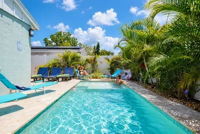 Private tropical pool oasis with loungers and sunny resort-style vibes