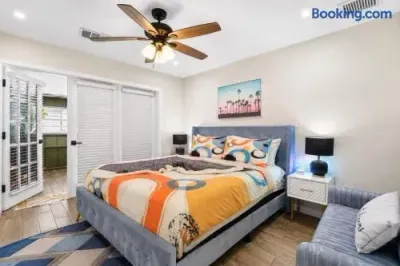 Bright, stylish bedroom with plush king bed and natural light