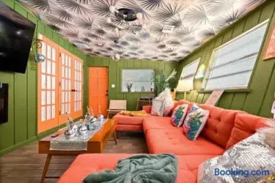 Bold tropical lounge with vibrant decor and spacious sectional seating