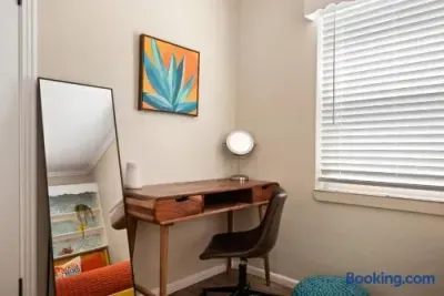 Bright, stylish workspace with desk, natural light, and modern decor