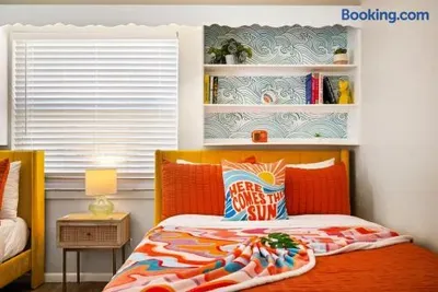 Bright, playful bedroom with vibrant decor and cozy modern touches