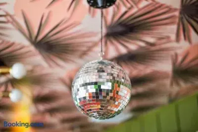 Chic tropical decor with a playful disco-ball accent