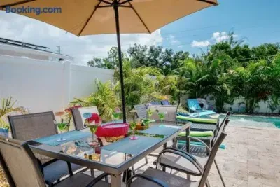 Private pool patio with shaded outdoor dining and tropical vibes