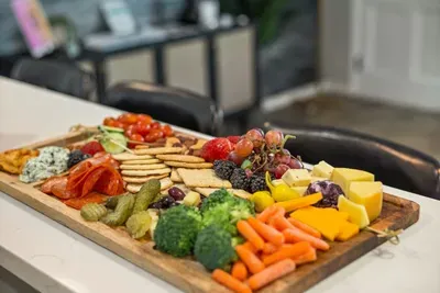 A delicious spread made for gathering, grazing, and enjoying every moment together. Fresh fruit, cheeses, vegetables, crackers, and savory bites make entertaining effortless—because the best memories are often made around good food and great company.