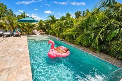 Private tropical pool oasis with loungers, shade, and resort-style vibes
