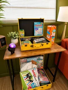 Games for every age — vintage suitcases packed with Taboo, Twister, Jenga, Sudoku, crayons, and more. 4-bedroom vacation rental, St. Pete, FL.