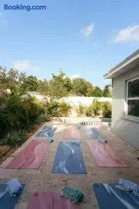 Private patio yoga setup with poolside tropical ambiance