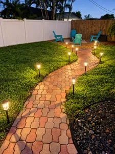 Follow the softly lit path to your own private backyard retreat. This peaceful outdoor space invites you to gather, unwind, and enjoy quiet evenings under the Florida sky—where the best vacation memories linger long after sunset.