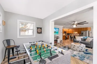 Family-friendly game room with foosball, magnetic darts, board games, puzzles and a children’s activity area.