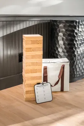 Fun indoor game setup with giant tumbling tower for guest entertainment