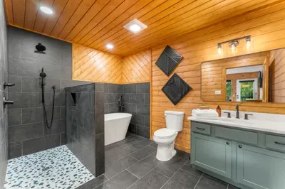 Spa-inspired bath with soaking tub, walk-in shower, and double vanity