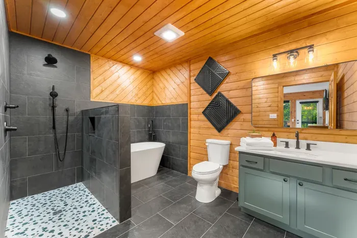 Spa-inspired bath with soaking tub, walk-in shower, and double vanity