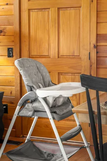 Family-friendly dining space with rustic wood interiors and high chair