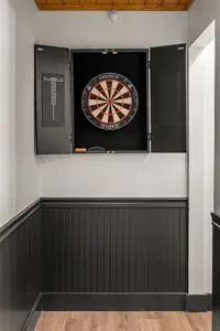 Built-in dartboard nook for fun indoor games and stylish guest entertainment