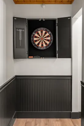 Built-in dartboard nook for fun indoor games and stylish guest entertainment