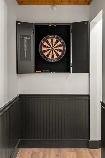 Built-in dartboard nook for fun indoor games and stylish guest entertainment