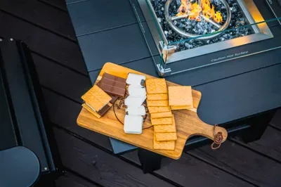 Cozy fire table with s’mores setup for unforgettable outdoor evenings