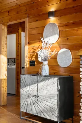 Warm wood-paneled entry with modern décor and convenient in-unit laundry