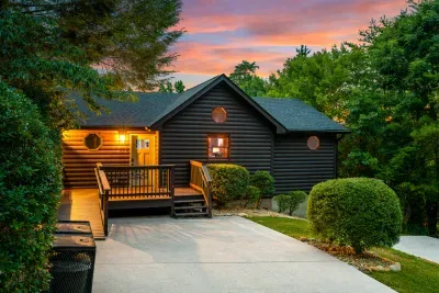 Cozy cabin retreat with private wooded setting and glowing sunset views