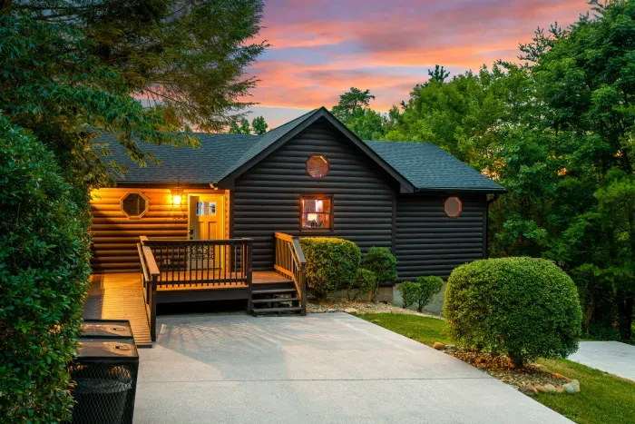 Cozy cabin retreat with private wooded setting and glowing sunset views