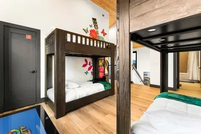 Open loft with two twin bunk beds, ideal for kids or extra guests