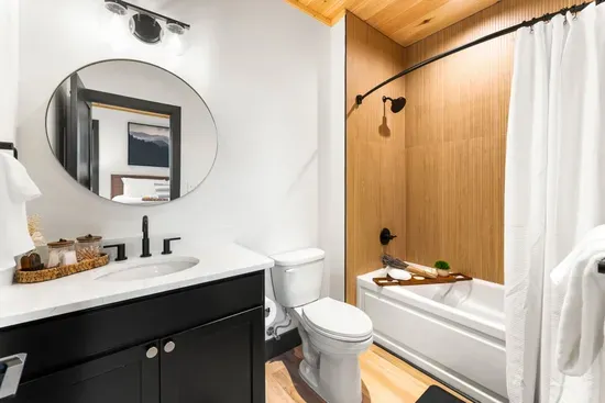 Spacious bathroom with a tub and shower.