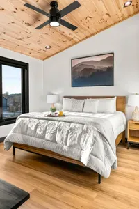 Spacious king bedroom with fresh linens.