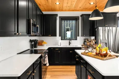 Fully equipped kitchen with modern appliances and ample space to cook and gather.