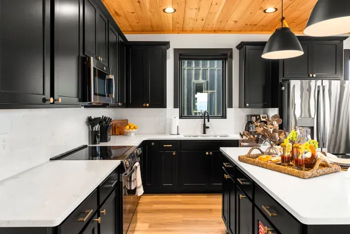Fully equipped kitchen with modern appliances and ample space to cook and gather.